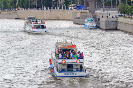 Moscow, Russia - June 19, 2018: Pleasure boats floating on Moskva river on a cloudy summer eveningのeditorial素材