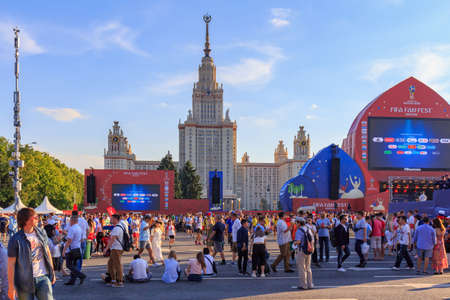 Moscow, Russia - June 28, 2018: Football fans on a background of Lomonosov Moscow State University...