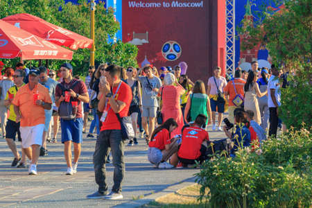 Moscow, Russia - June 28, 2018: Football fans walking on a FIFA Fan Fest 2018 in Moscowのeditorial素材