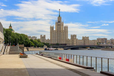 Moscow, Russia - June 21, 2018: Stalin's skyscraper on Kotelnicheskaya embankment on a background of green trees and blue sky on a sunny summer morningのeditorial素材
