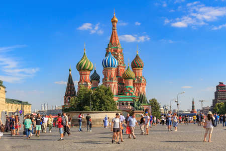 Moscow, Russia - June 28, 2018: Tourists walking on Red square on a background of St. Basil's Cathedral in sunny summer eveningのeditorial素材