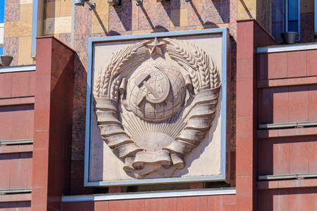 Moscow, Russia - August 01, 2018: Coat of arms of Union of Soviet Socialist Republics on facade of Monument Worker and collective farm girl on Exhibition of Achievements of National Economy (VDNH)のeditorial素材