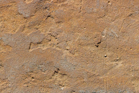 Texture of vintage brown clay plastered wall. Abstract clay wall background