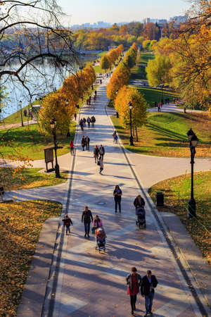Moscow, Russia - October 17, 2018: Tourists walking of alley in Tsaritsyno park in Moscow at sunny...