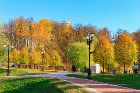 Moscow, Russia - October 17, 2018: Tourists walking on alleys at sunny autumn day in Tsaritsyno park in Moscowのeditorial素材