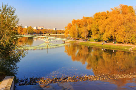 Moscow, Russia - October 17, 2018: View of pond and bridge over water surface in Tsaritsyno park in Moscow at sunny autumn dayのeditorial素材