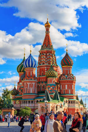 Moscow, Russia - September 30, 2018: Tourists on Red Square in Moscow on a background of St. Basil's Cathedral in sunny dayのeditorial素材