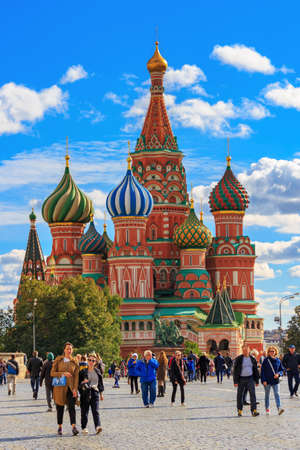 Moscow, Russia - September 30, 2018: Tourists walk on Red Square agains St. Basil Cathedral in sunny day. Moscow historical center landscapeのeditorial素材
