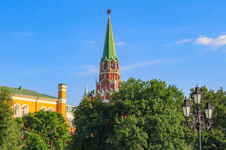 Moscow, Russia - June 28, 2018: Tower and building of Moscow Kremlin against blue sky and green trees in sunny dayのeditorial素材