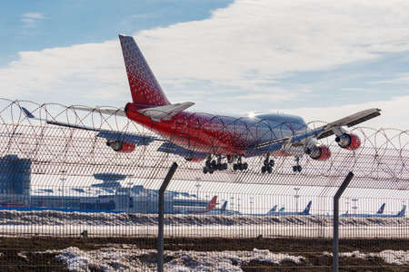 Moscow, Russia - March 14, 2019: Aircraft Boeing 747-446 EI-XLH of Rossiya - Russian Airlines going to landing at Vnukovo airport in Moscow on a blue sky background at sunny dayのeditorial素材