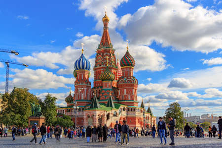 Moscow, Russia - September 30, 2018: Tourists walking on Red Square in Moscow against St. Basil Cathedral in sunny dayのeditorial素材