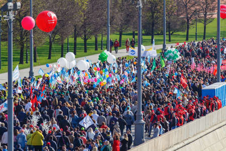 Moscow, Russia - May 01, 2019: Column of demonstrators on Kremlevskaya embankment against Moscow Kremlin. May Day celebration in Moscowのeditorial素材