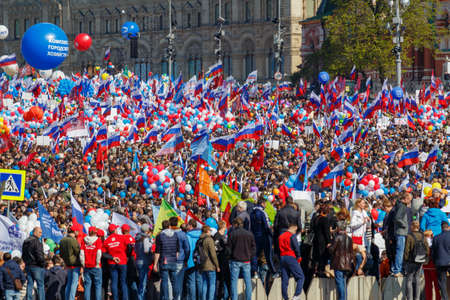 Moscow, Russia - May 01, 2019: Demonstrators with flags and colored balloons near St. Basils Cathedral on Red Square. May Day celebration in Moscowのeditorial素材