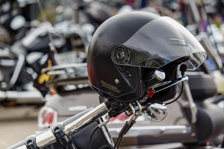 Moscow, Russia - May 04, 2019: Motorcycle helmet with Harley Davidson motorcycles emblem closeup on...