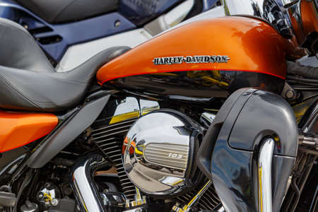 Moscow, Russia - May 04, 2019: Bright orange fuel tank with emblem of Harley Davidson motorcycles...