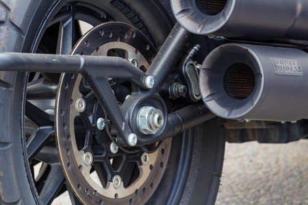 Moscow, Russia - May 04, 2019: Rear wheel and exhaust system pipes of Harley Davidson motorcycle...