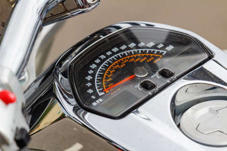 Moscow, Russia - May 04, 2019: Chromed speedometer on the glossy silvery fuel tank of Suzuki Boulevard M109R cruize motorcycle closeup. Moto festival MosMotoFest 2019のeditorial素材