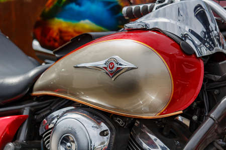 Moscow, Russia - May 04, 2019: Glossy red and bronze fuel tank of motorcycle with Kawasaki Vulcan...