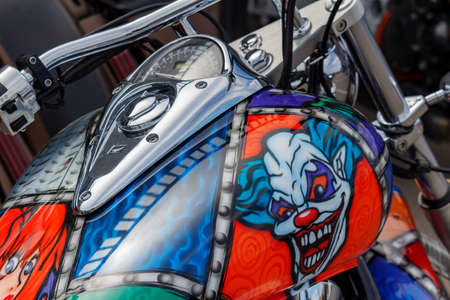 Moscow, Russia - May 04, 2019: Honda motorcycle with airbrushing of evil clown on fuel tank closeup....