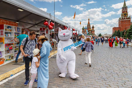 Moscow, Russia - June 02, 2019: Animator dressed as a White cat at the Book festival Red Square 2019 in Moscowのeditorial素材