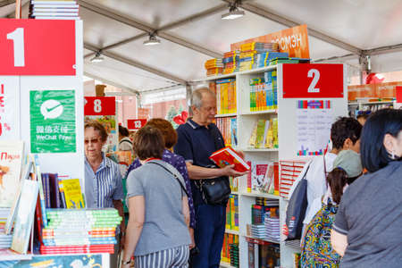 Moscow, Russia - June 02, 2019: Visitors near stands with books at the Book festival Red Square 2019 in Moscowのeditorial素材