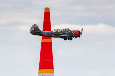 Balashikha, Moscow region, Russia - May 25, 2019: Soviet primary trainer aircraft Yakovlev Yak-52 RA-1773G performs aerobatics over Chyornoe airfield at Aviation festival Sky Theory and Practice 2019のeditorial素材