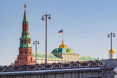 Moscow, Russia - May 01, 2019: Buildings of Moscow Kremlin closeup on a background of Bolshoy Kamenny Bridge above Moskva river in sunny morningのeditorial素材
