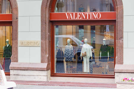 Moscow, Russia - June 02, 2019: Glass showcase with mannequins on the facade of Valentino boutique in the center of Moscowのeditorial素材