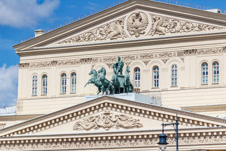 Moscow, Russia - June 02, 2019: Facade of Bolshoi Theatre in Moscow closeup at sunny day against blue sky with white cloudsのeditorial素材