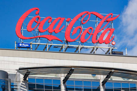 Moscow, Russia - May 04, 2019: Coca Cola signboard on the roof of modern building in the center of...