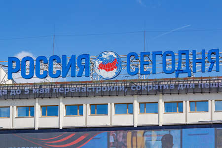 Moscow, Russia - May 04, 2019: Signboard of International news Agency Russia today on the roof of...