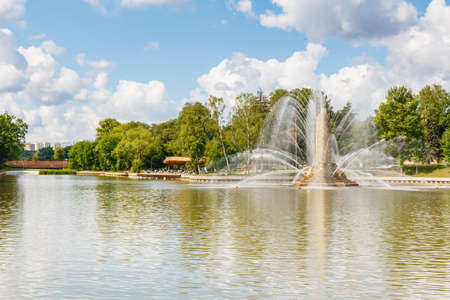 Moscow, Russia - July 22, 2019: View of Golden Spike fountain and Kamensky pond in VDNH park in Moscow at sunny summer day. VDNH park is russian popular touristic landmarkのeditorial素材
