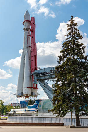 Moscow, Russia - July 22, 2019: View of soviet space rocket Vostok near pavilion Kosmos in VDNH park in Moscow against blue sky with white clouds at sunny summer dayのeditorial素材