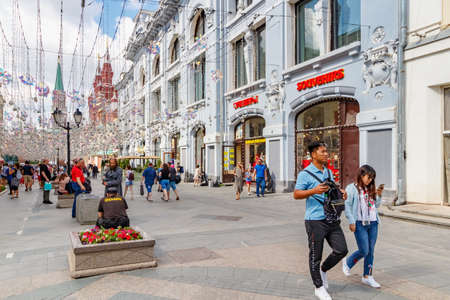 Moscow, Russia - July 28, 2019: Tourists near souvenir shop on Nikolskaya street in Moscow. Popular touristic place at sunny summer morningのeditorial素材