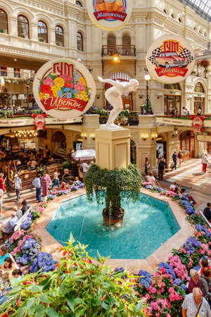 Moscow, Russia - July 28, 2019: Fountain in the center of GUM on Red square in Moscow. Interiors of GUM State Department Storeのeditorial素材
