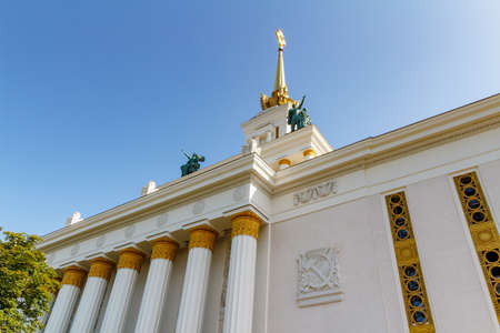 Moscow, Russia - July 22, 2019: Facade of USSR pavilion against blue sky in VDNH park in Moscow. VDNH architecture at sunny summer morningのeditorial素材