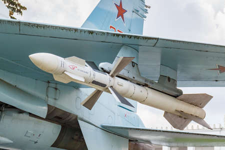 Moscow, Russia - July 22, 2019: Rocket under wing of russian fighter-bomber SU-27 closeup. VDNH park...