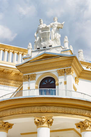 Moscow, Russia - July 22, 2019: Figures on the roof of RSFSR pavilion on VDNH in Moscow against cloudy sky in summer day. Architecture of VDNH parkのeditorial素材