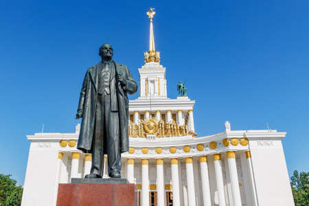 Moscow, Russia - July 22, 2019: Monument to Vladimir Lenin against pavilion USSR on VDNH on a blue sky background at sunny summer morning. VDNH park is popular touristic place in Moscowのeditorial素材