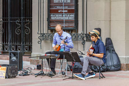 Moscow, Russia - September 13, 2019: Street musicians play music near Vakhtangov theater on Arbat street in Moscowのeditorial素材