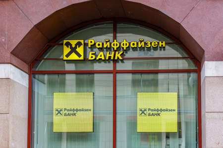 Moscow, Russia - September 13, 2019: Arched window with signboards of Raiffeisen Bank in Moscow downtown. Raiffeisen Bank sign in russianのeditorial素材
