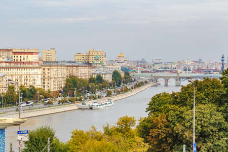 Moscow, Russia - August 13, 2019: Top view of Frunzenskaya embankment of Moskva River and Pushkinsky Bridge against cloudy sky at summer day. Panorama of Moscow historical centerのeditorial素材