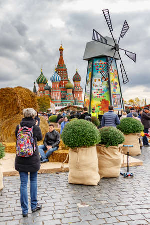 Moscow, Russia - October 05, 2019: People takes a photo on a windmill background. Traditional...