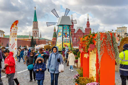 Moscow, Russia - October 08, 2019: People walking on Red Square against decorations of the...