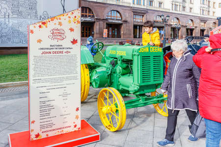 Moscow, Russia - October 08, 2019: Restored american wheel tractor JOHN DEERE D Popping Johnnie on the exhibition of agricultural machinery on Revolution Square in Moscow at sunny autumn dayのeditorial素材