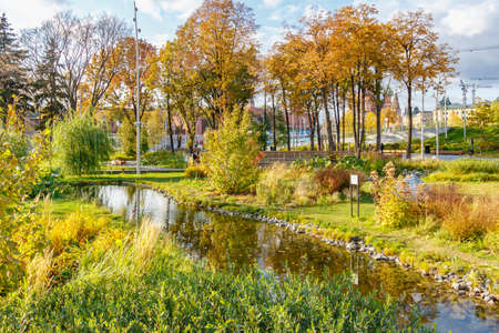 Moscow, Russia - October 08, 2019: Small pond among decorative lawn in Zaryadye Park in Moscow. Zaryadye Park landscape in sunny autumn dayのeditorial素材