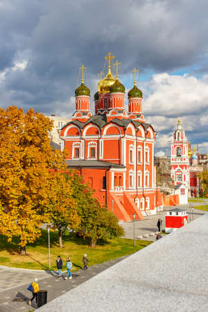 Moscow, Russia - October 08, 2019: Orthodox churches in the Zaryadye Park in Moscow at sunny autumn day against colored trees. Architecture of Moscow historical centerのeditorial素材