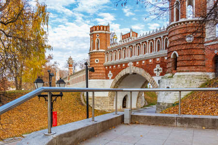 Moscow, Russia - October 16, 2019: Figured Bridge in Tsaritsyno Park against blue sky in sunny autumn day. Figured Bridge is popular landmark in Tsaritsyno Park in Moscowのeditorial素材