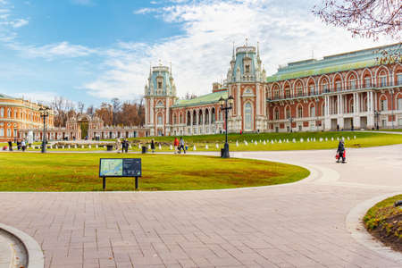 Moscow, Russia - October 16, 2019: People walking on footpaths on square in front of Grand Palace in Tsaritsyno Park at sunny autumn day. Tsaritsyno Park is a popular holiday destination in Moscowのeditorial素材
