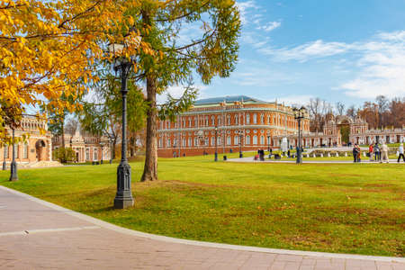 Moscow, Russia - October 16, 2019: Building of Bread House in Tsaritsyno Park against green lawn and...